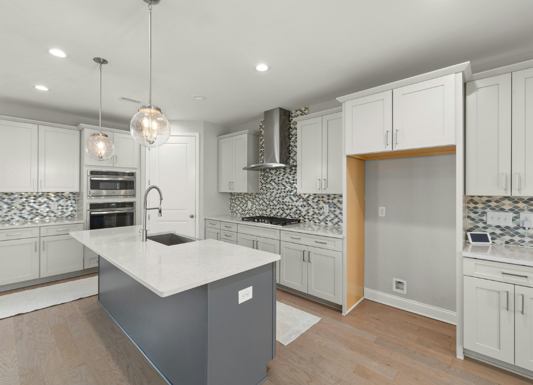 Fitted kitchens: finished island and painted cabinetry